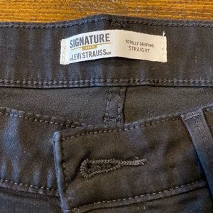 Levi Strauss black straight jeans with stretch.